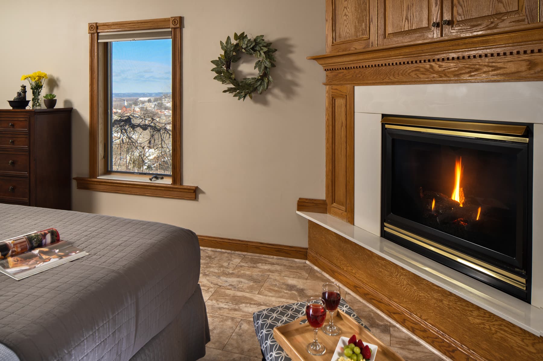 bedroom with fan and fireplace