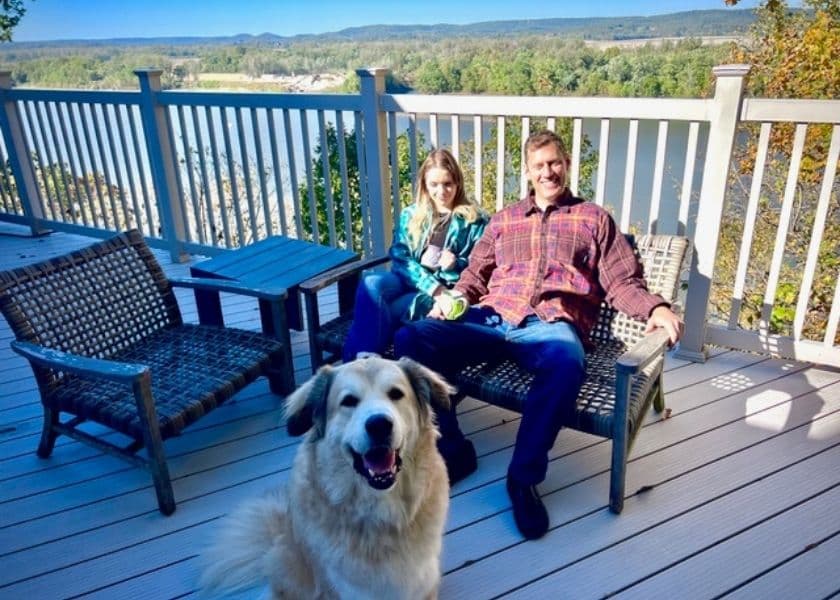 romantic couple relaxing outside on deck with dog during autumn at hermann hill romantic couple relaxing outside on deck with dog during autumn at hermann hill