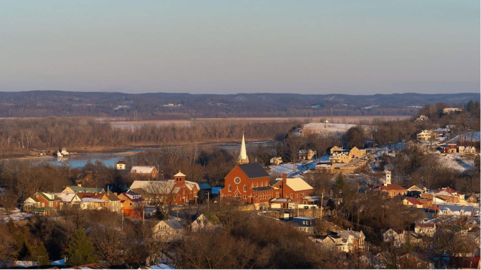 Aerial view of downtown Hermann in the wintertime with a church steeple and the Missouri River in the background