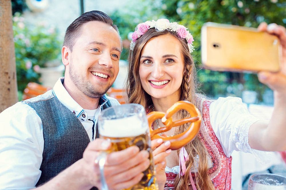 couple taking a selfie at Hermann Oktoberfest